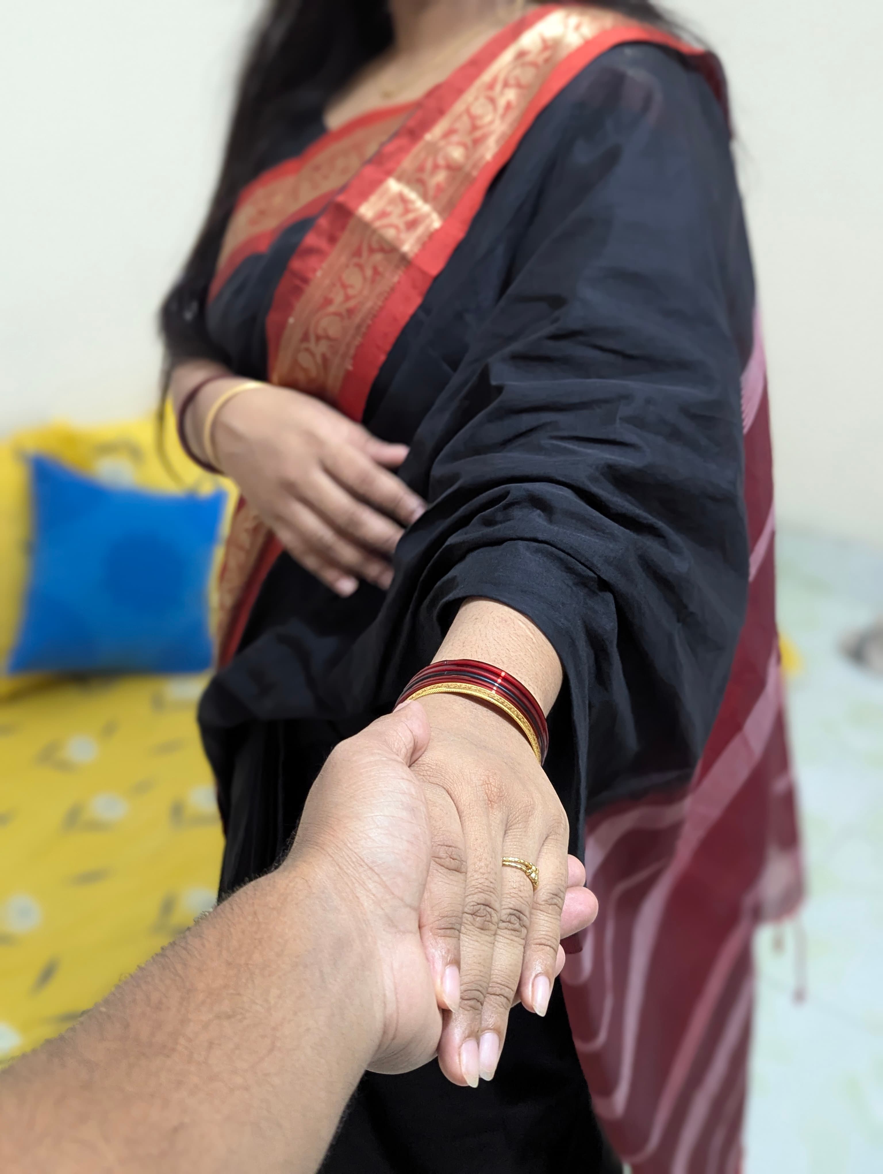 Our hands — her mehndi, her gold ring, his arm